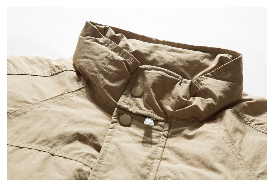 Tan jacket collar and upper placket with snap buttons and visible topstitching.