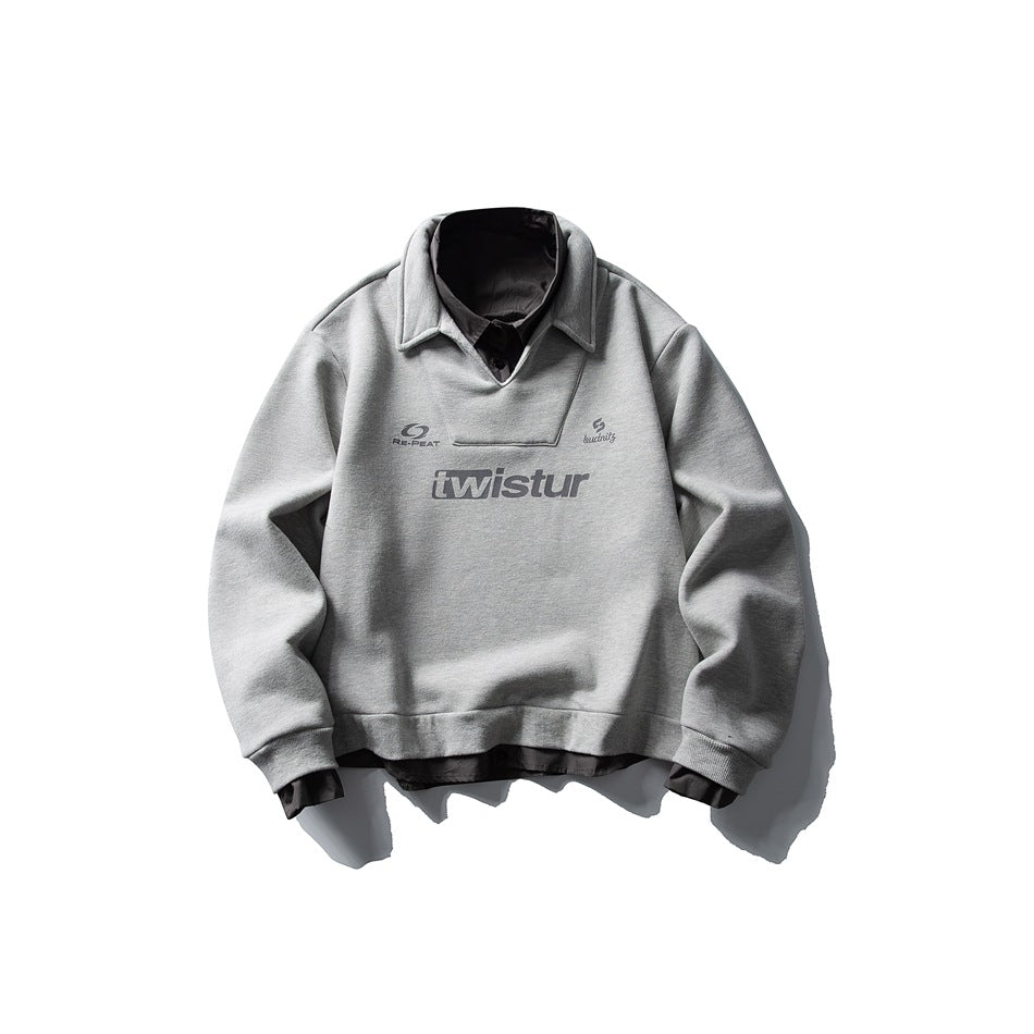 Gray sweatshirt with dark gray shirt collar and hem layered underneath and a gray 'twistur' chest print, flat lay