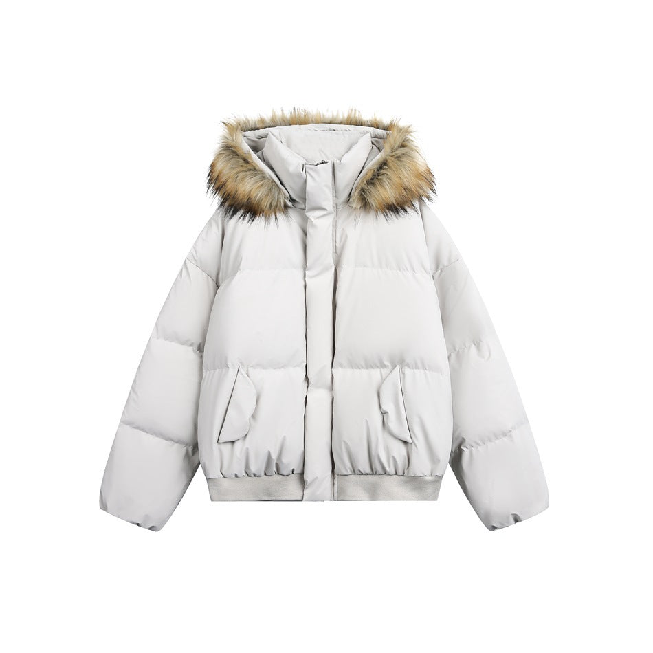 Light gray puffer jacket with fur-trimmed hood, center placket, flap pockets and ribbed hem, flat front view