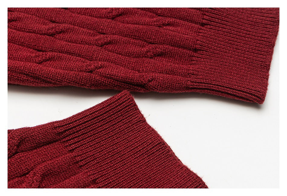 Close-up of burgundy cable-knit sleeves and ribbed cuffs.