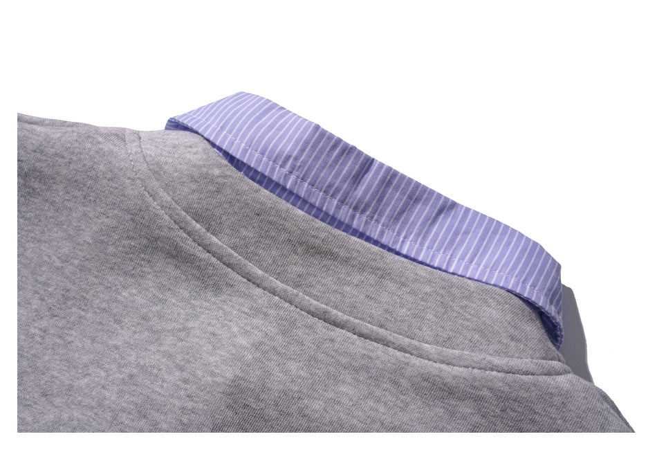 Close-up of the back neckline, with a lavender and white striped collar over gray fabric.
