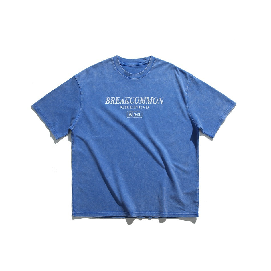 Blue washed-look short-sleeve crew-neck T-shirt with white distressed lettering graphic on the chest, flat lay