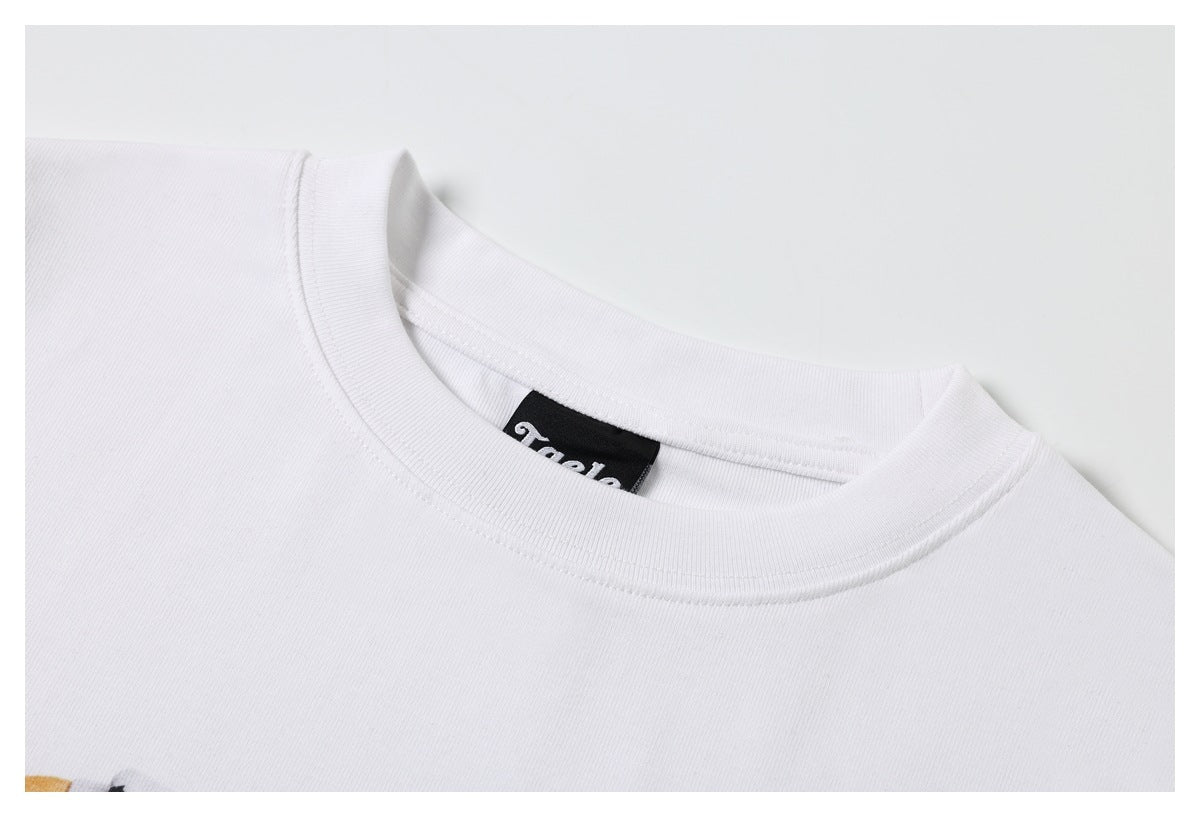 Close-up of a white T-shirt’s crew neckline and black inner neck label.