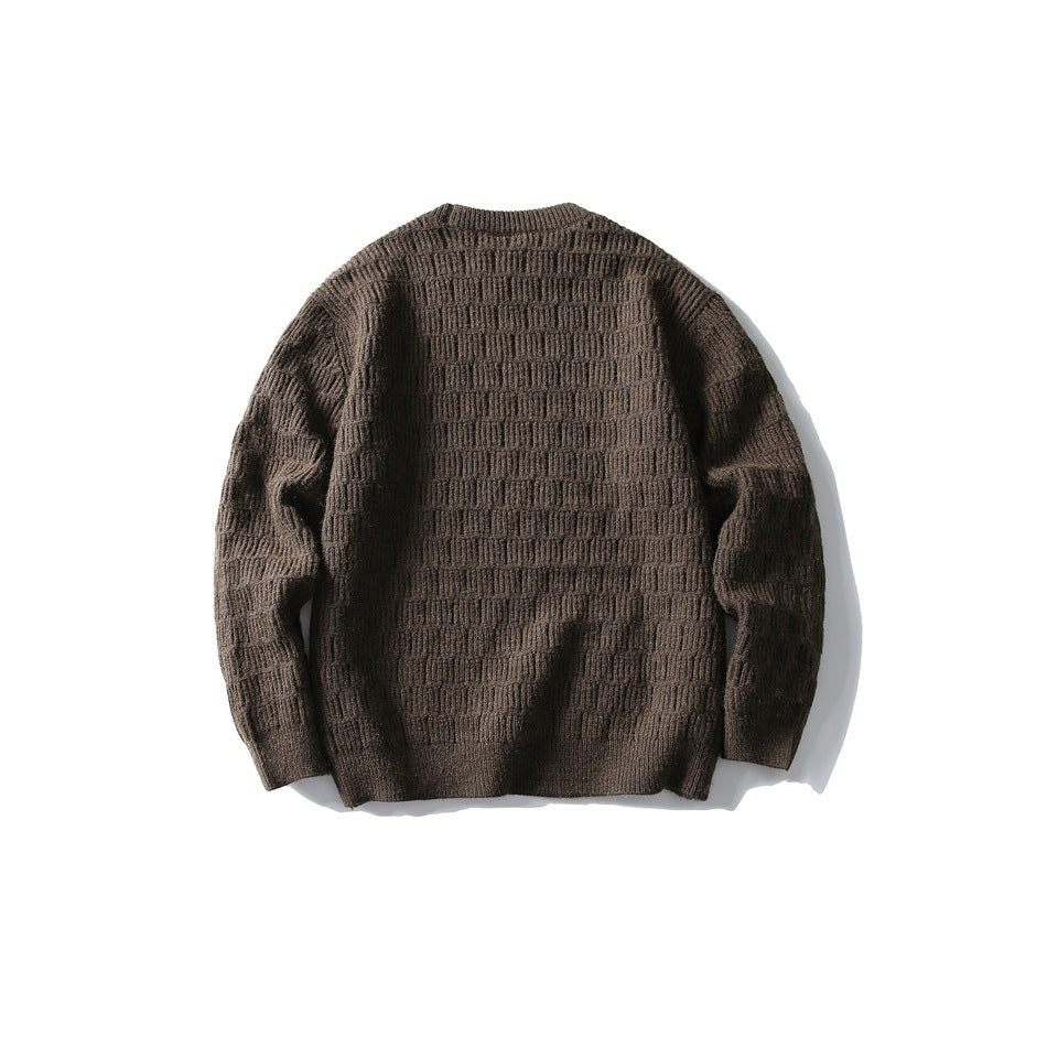Back view of a dark brown crewneck sweater with a raised horizontal knit pattern.