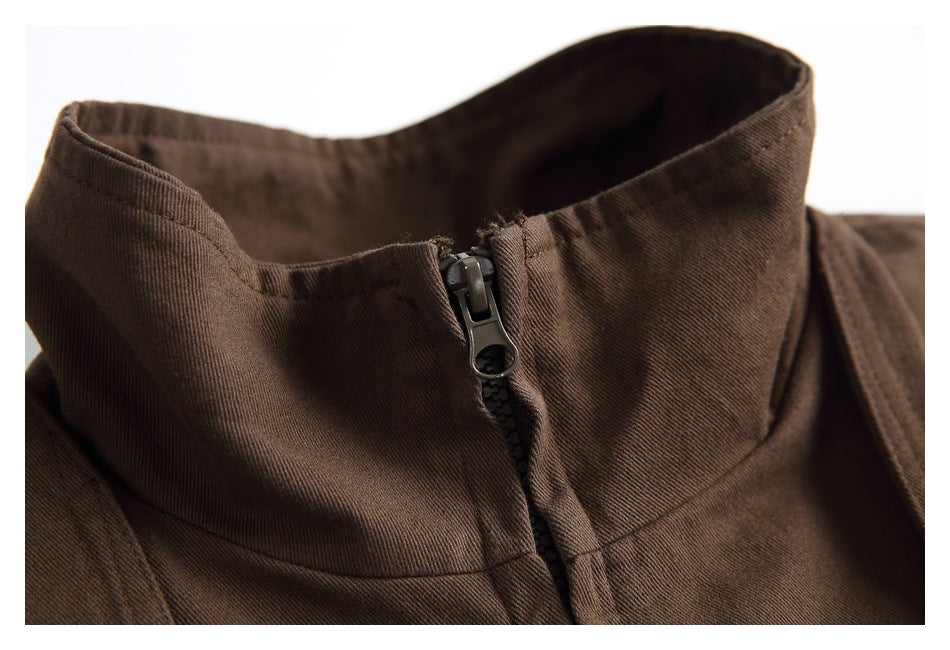 Close-up of the brown jacket’s stand collar and front zipper.