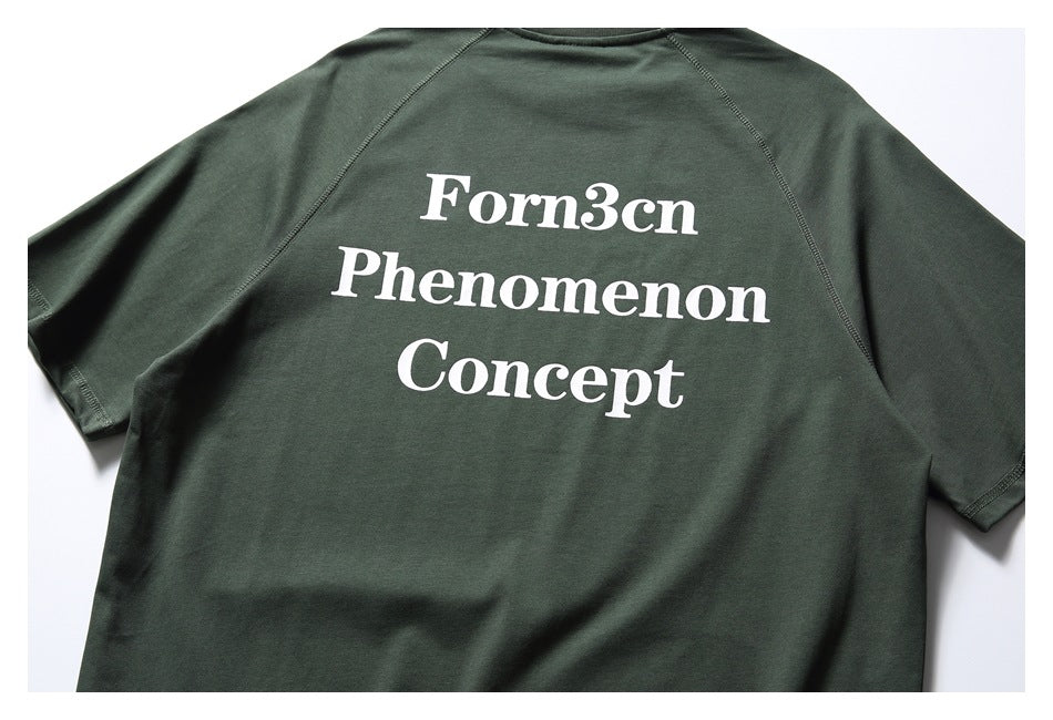 Back of a dark green short-sleeve raglan T-shirt with large white “Forn3cn Phenomenon Concept” text.