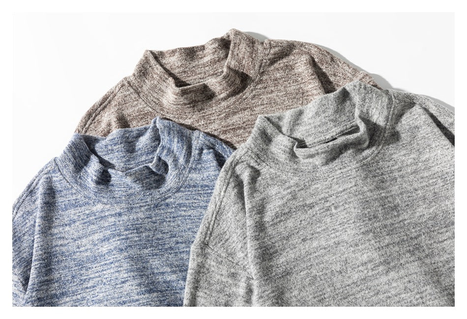 Three marled long-sleeve tops with short collars shown in brown-gray, blue, and light gray.