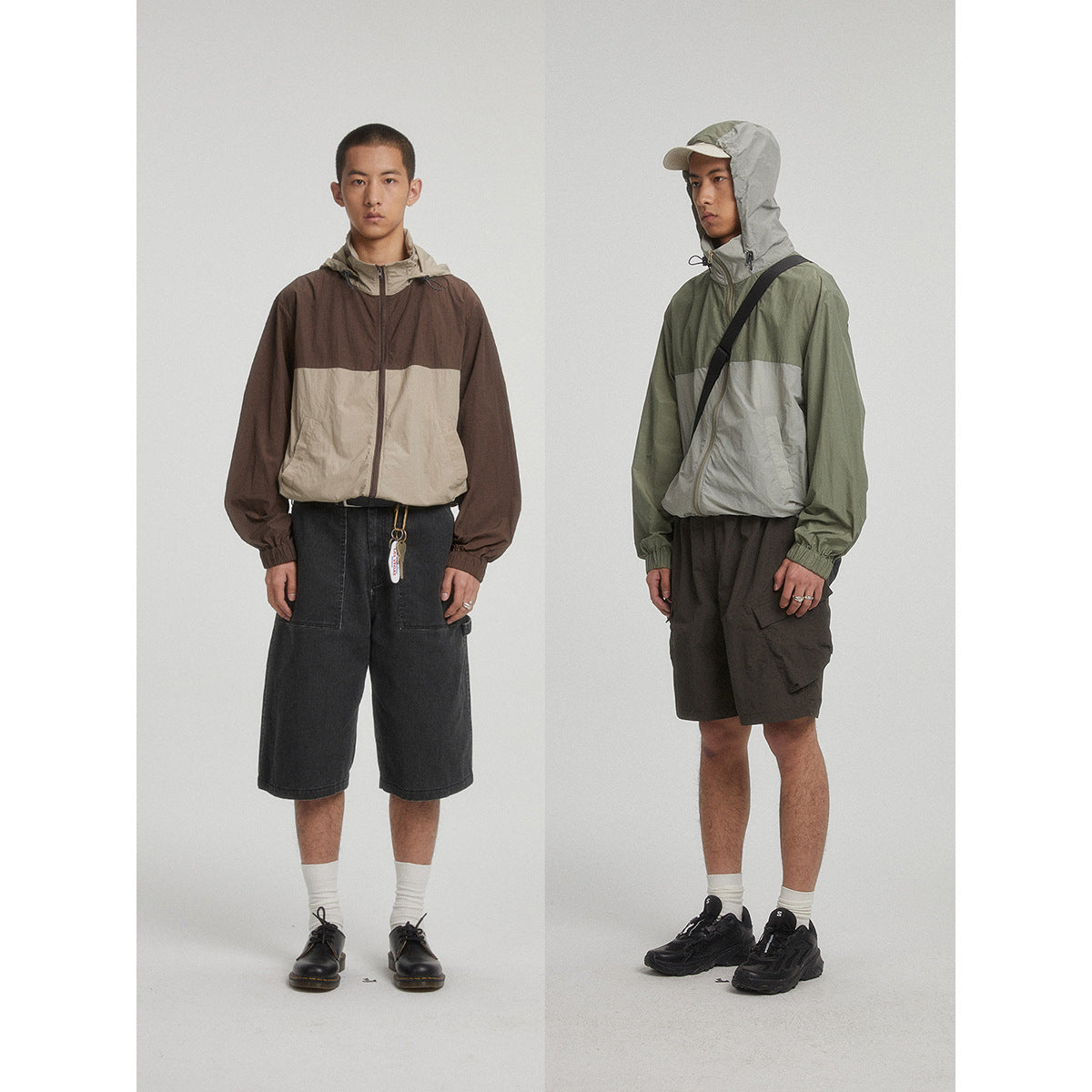 Two models wear hooded color-block windbreakers: brown and beige, and olive green and light gray.