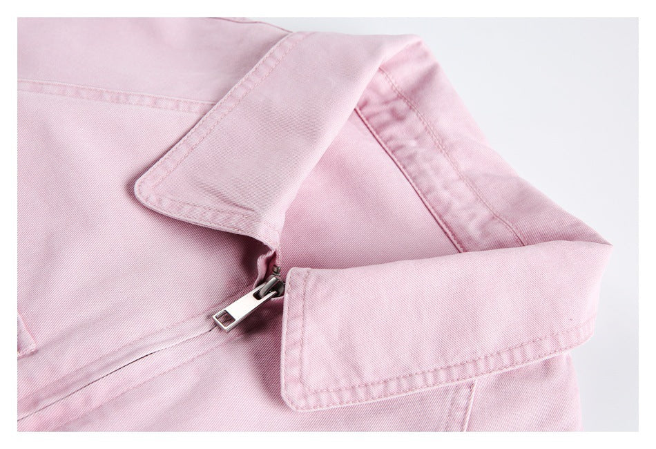 Close-up of the pink jacket's pointed collar and metal front zipper.