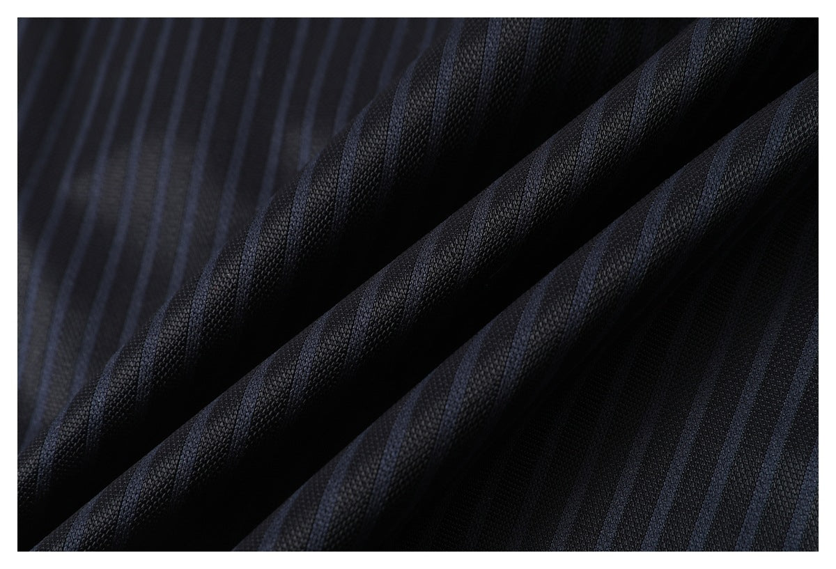 Macro view of dark jersey fabric with subtle blue pinstripes and a textured knit surface.