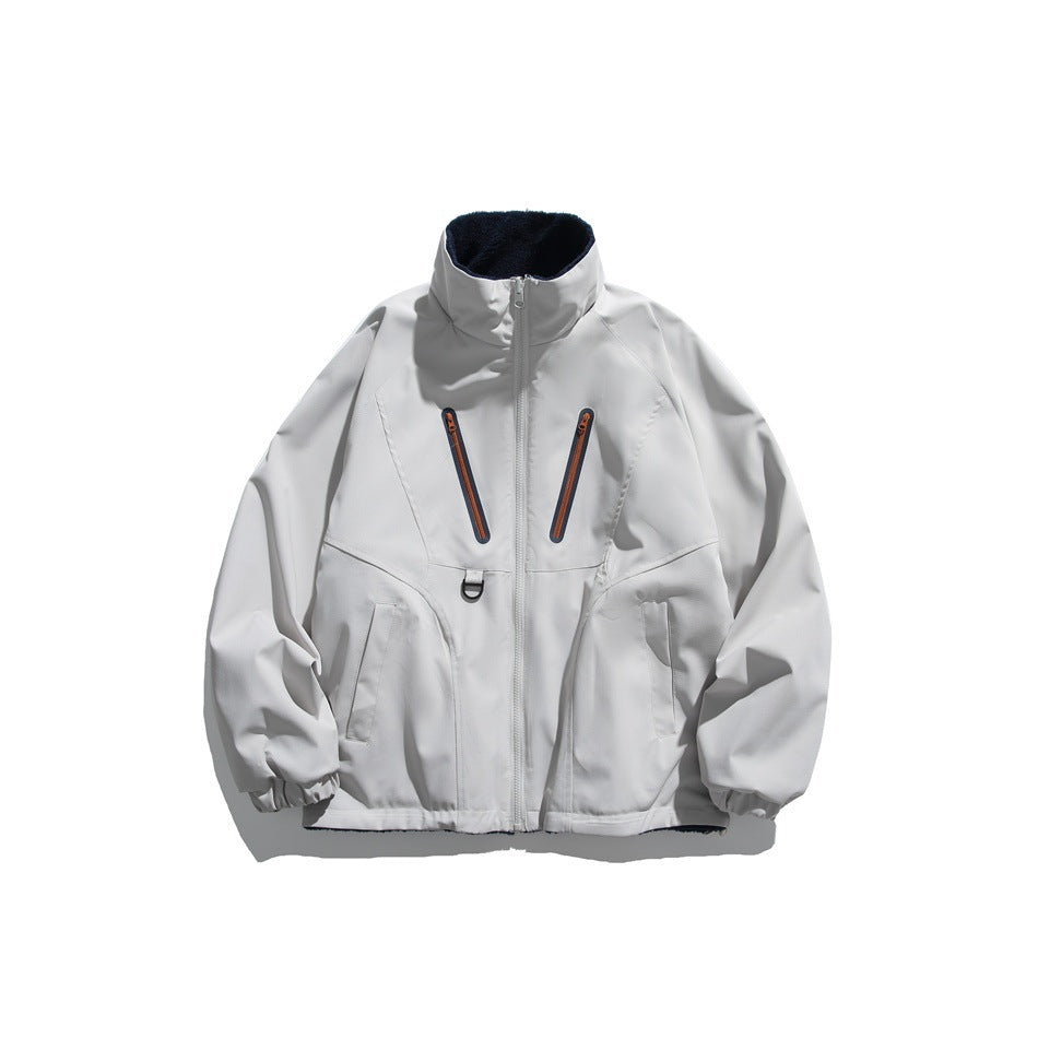 Light gray stand-collar zip jacket with orange-trimmed diagonal chest zip pockets and navy fleece-like collar lining