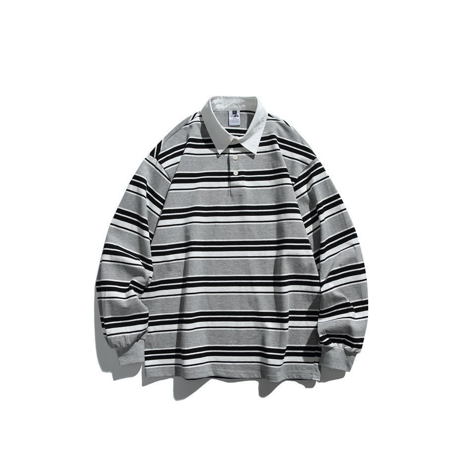 Gray, black and white striped long-sleeve polo top with white collar and two buttons, flat lay