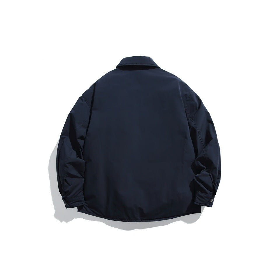 Back view of a navy collared jacket with long sleeves and buttoned cuffs, shown flat against white.
