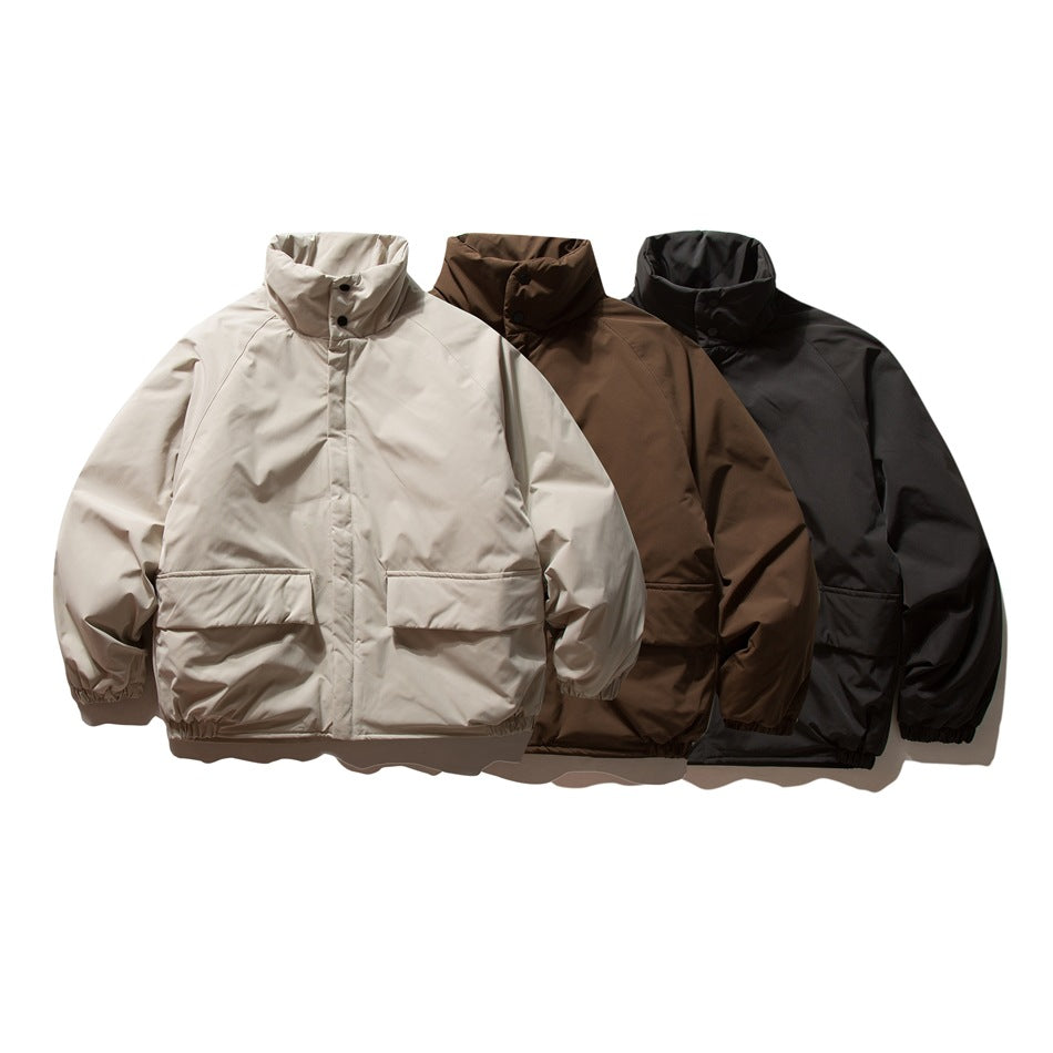 Three front-facing jackets with high collars and large flap pockets in light beige, brown, and black.