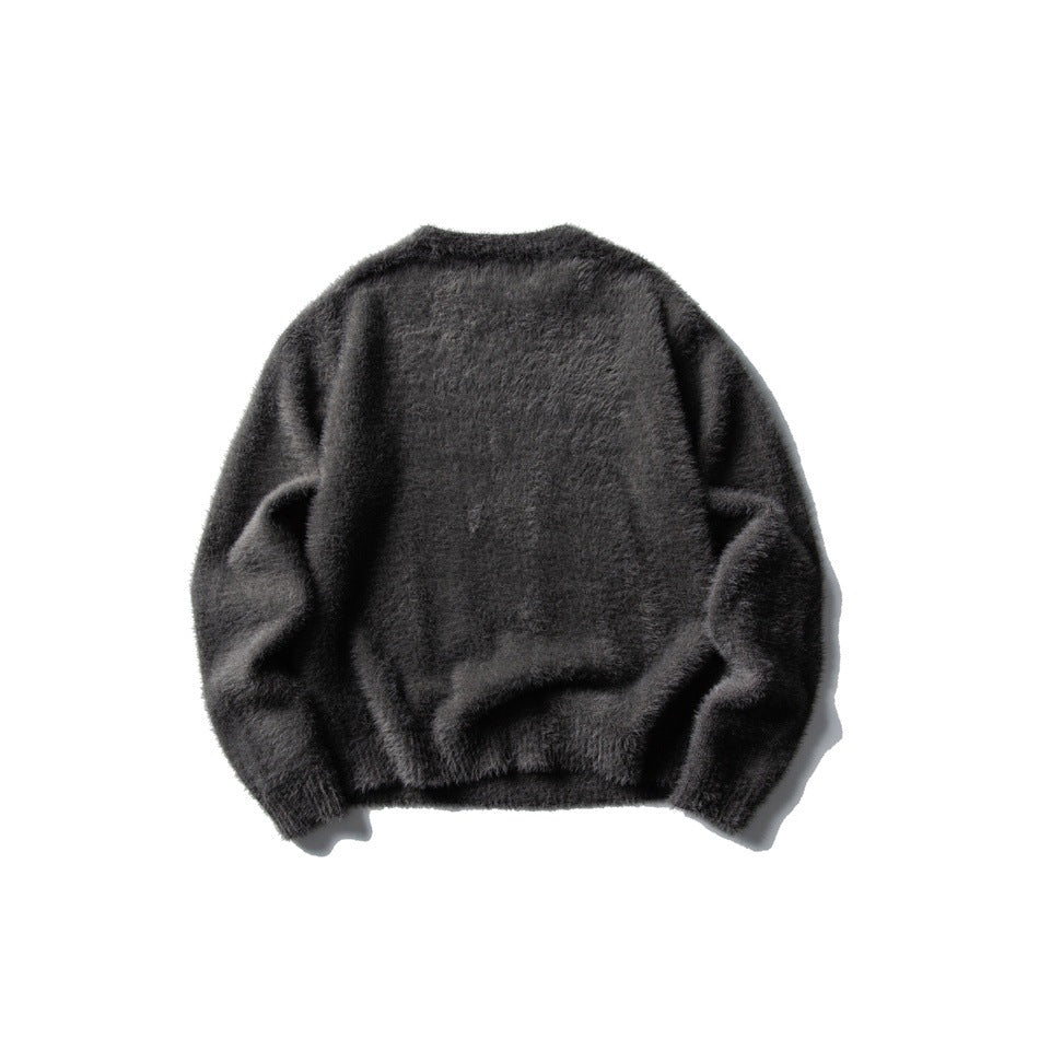 Back view of a charcoal-gray fuzzy crew-neck sweater with long sleeves and ribbed cuffs and hem, laid flat.