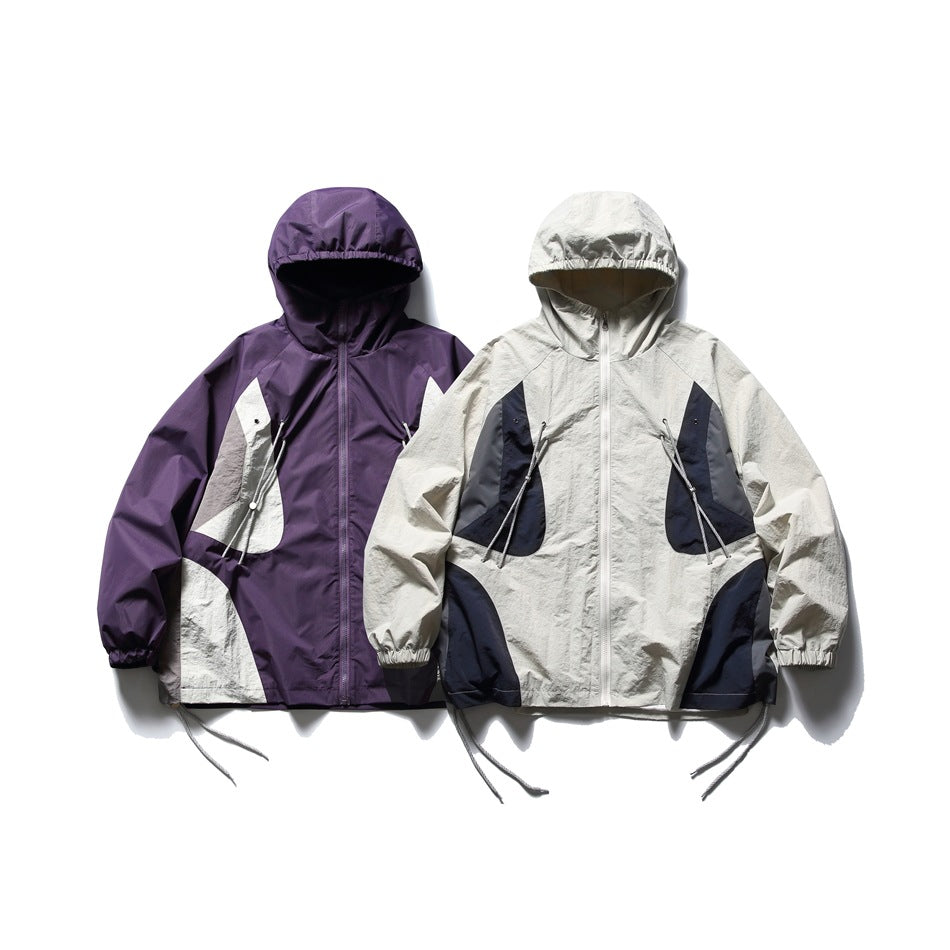 Two hooded jackets shown from the front: one purple and off-white, the other off-white with navy and gray panels.