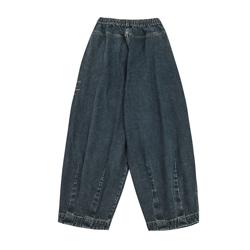 Back flat-lay of blue washed denim wide-leg jeans with elastic back waistband and lower leg seams