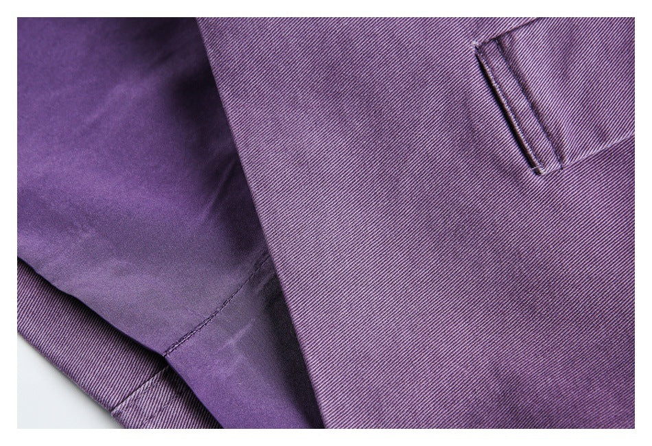 Close-up showing a narrow pocket opening and smooth purple lining inside the garment.