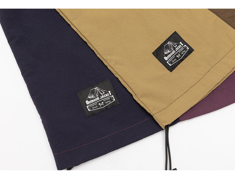 Tan, navy, purple and brown jacket panels shown together, with sewn labels and a hem drawcord.