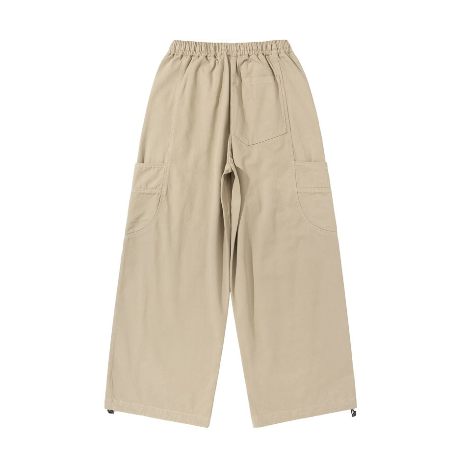 Light khaki wide-leg cargo pants flat lay, back view with elastic waistband, back patch pocket and side cargo pockets
