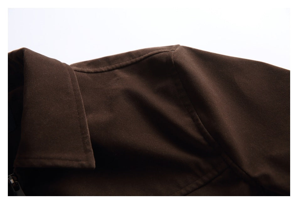 Close-up of the dark brown jacket's collar, shoulder seam, and upper sleeve.
