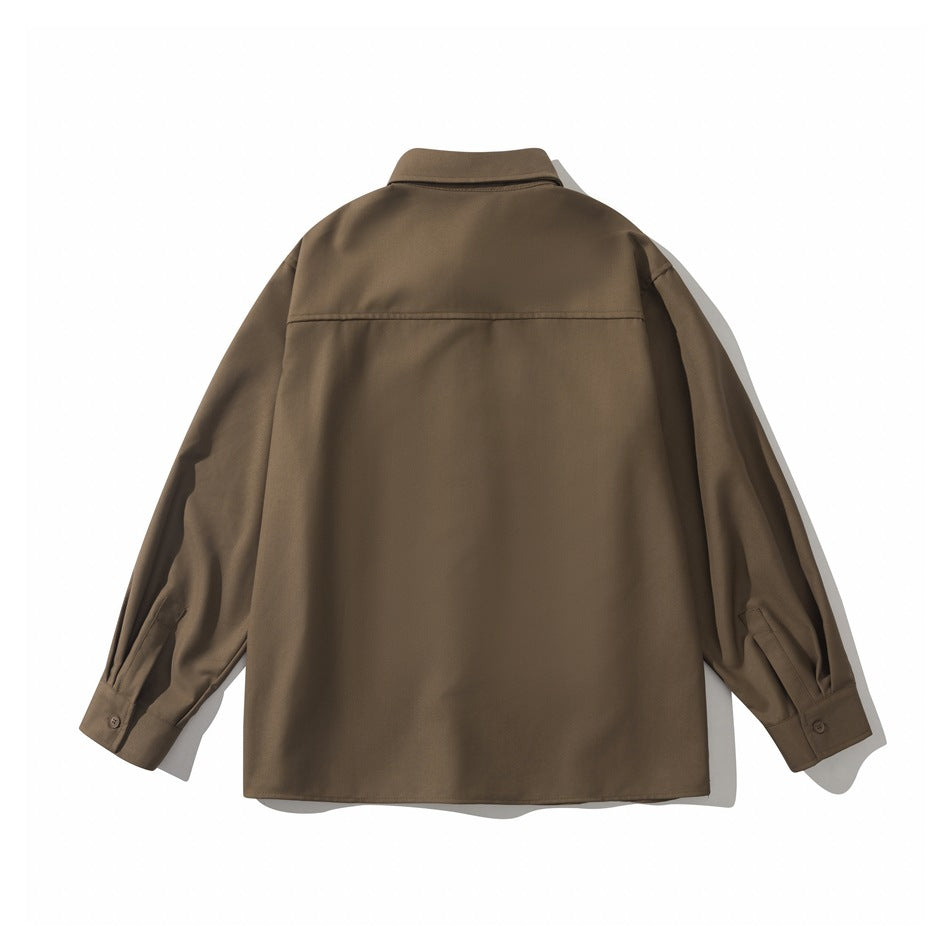 Back view of brown long-sleeve shirt with back yoke seam and buttoned cuffs with sleeve plackets, flat lay