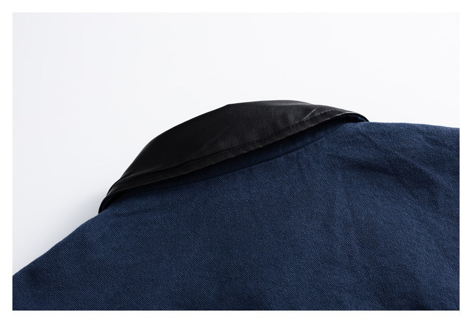 Close-up of a navy jacket with a folded black collar.
