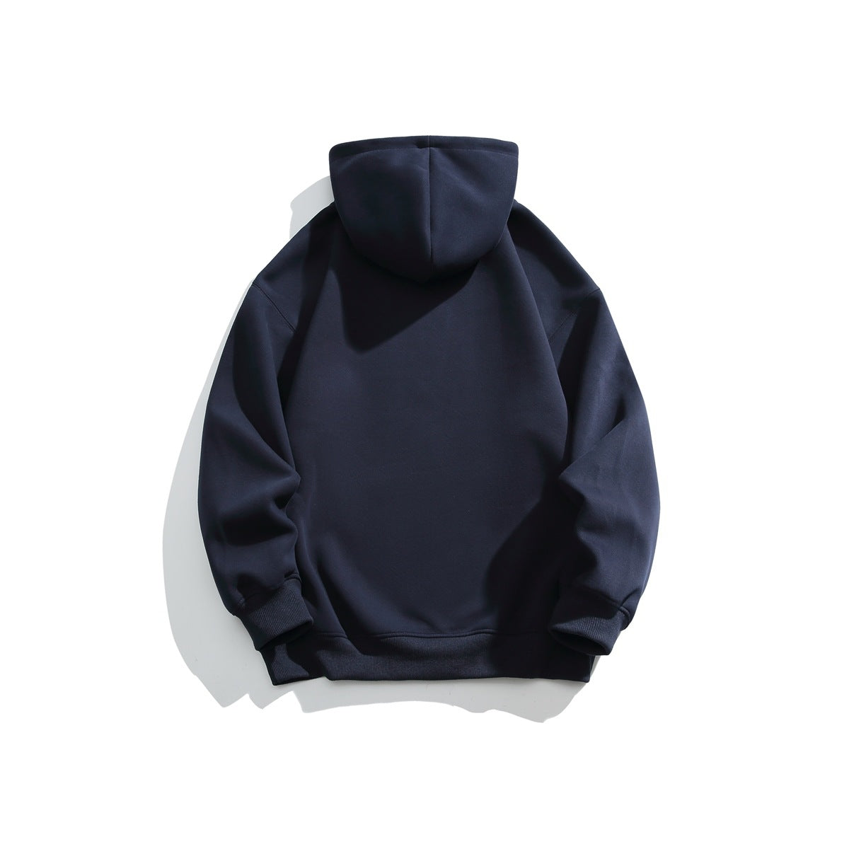 Back view of navy pullover hoodie with plain back, hood and ribbed cuffs and hem, flat lay