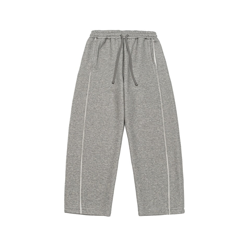 Light gray heathered wide-leg sweatpants with drawstring waist and white piping seams, flat lay front view