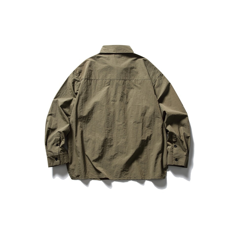 Rear view of an olive-brown long-sleeve collared shirt laid flat against a white background.
