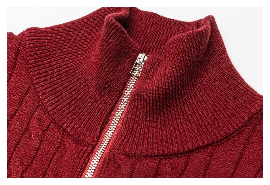 Close-up of the burgundy sweater's ribbed high collar and silver quarter-zip closure.