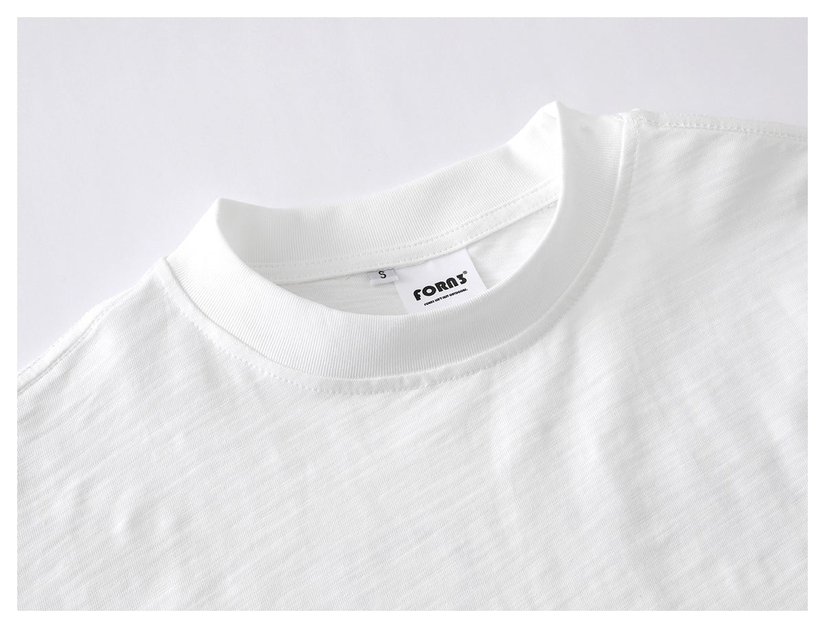 Close-up of a white crew-neck shirt collar with visible size and inner labels.
