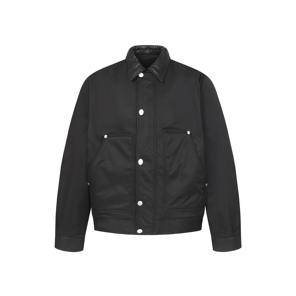 Black jacket with snap front, collar and two large patch pockets with rivets, flat front view