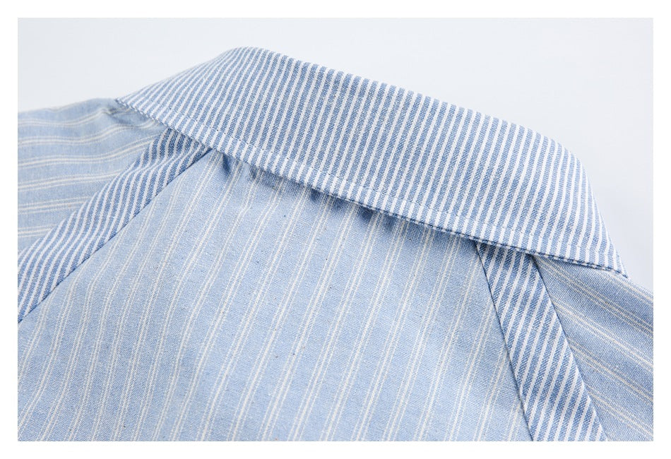 Close-up of a blue-and-white striped shirt collar and light blue pinstriped body.