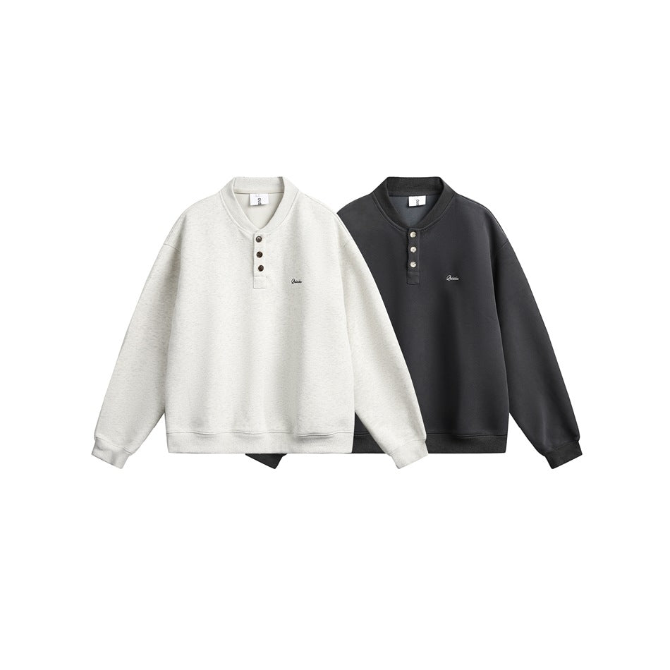 Two henley sweatshirts displayed together in off-white and charcoal, each with three buttons and small chest embroidery.