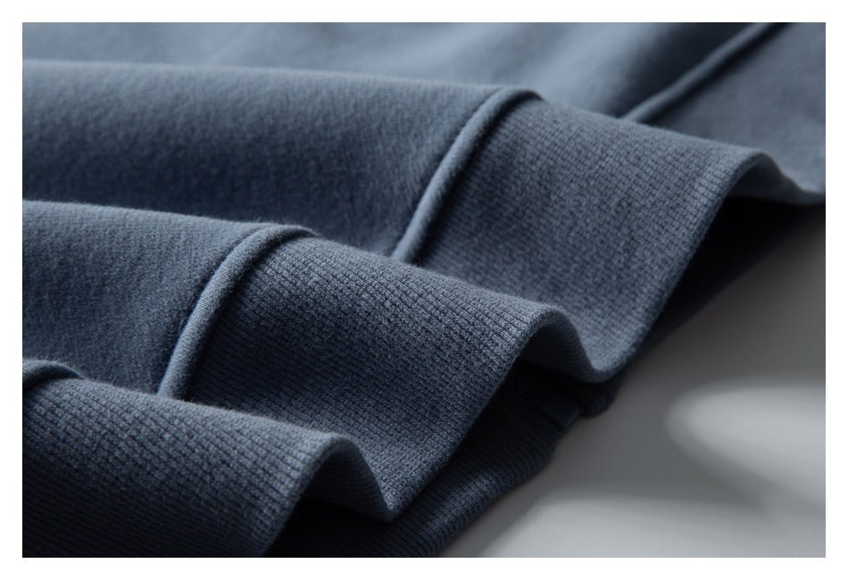 Close-up of ribbed blue garment edging folded into soft waves.