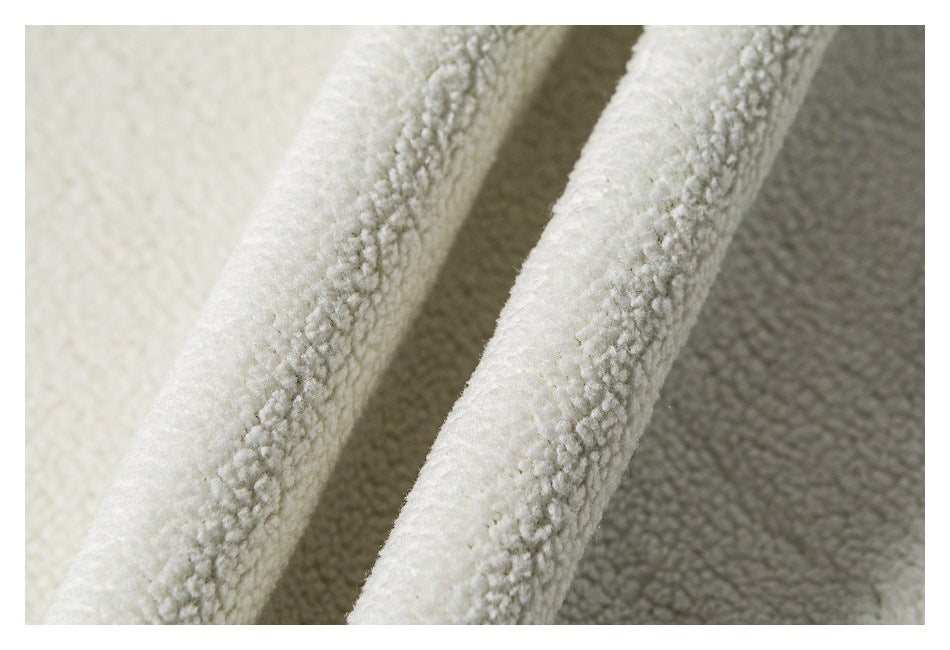 Close-up of soft white fleece lining and its textured surface.