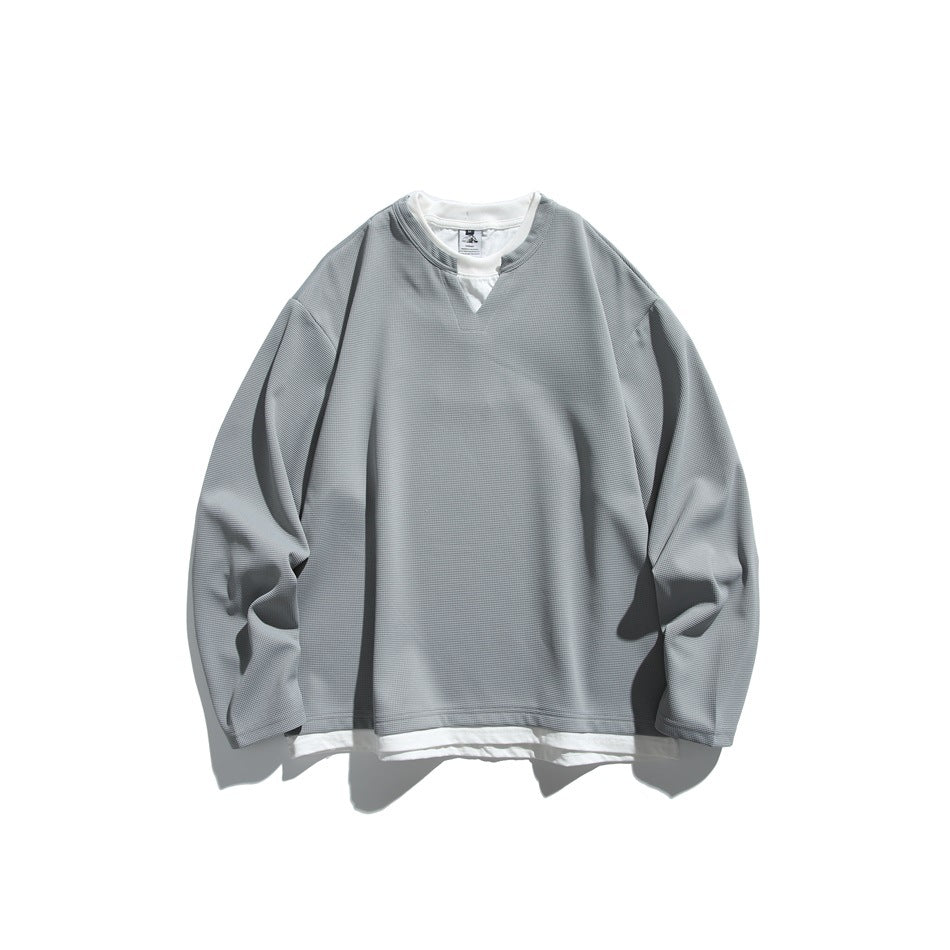 Gray long-sleeve waffle-texture pullover with white layered neckline and hem, flat lay front view