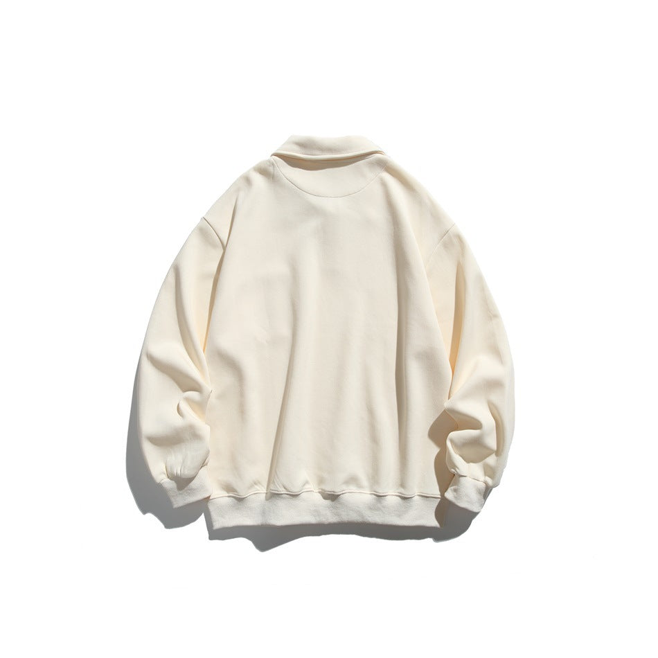 Back view of a cream collared pullover with long sleeves and ribbed cuffs and hem.