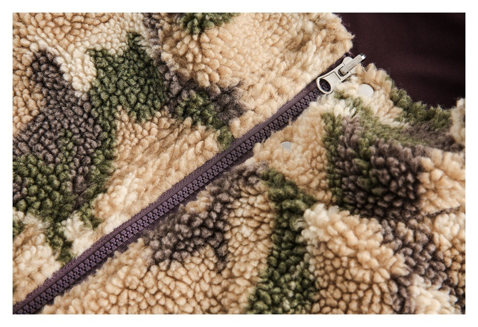 Close-up of the jacket's burgundy zipper and silver pull against its camouflage sherpa fabric.