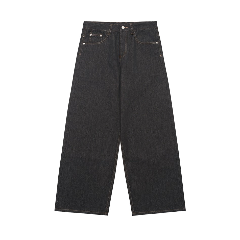 Front view of dark charcoal wide-leg jeans with tan topstitching, button fly and five-pocket styling on white
