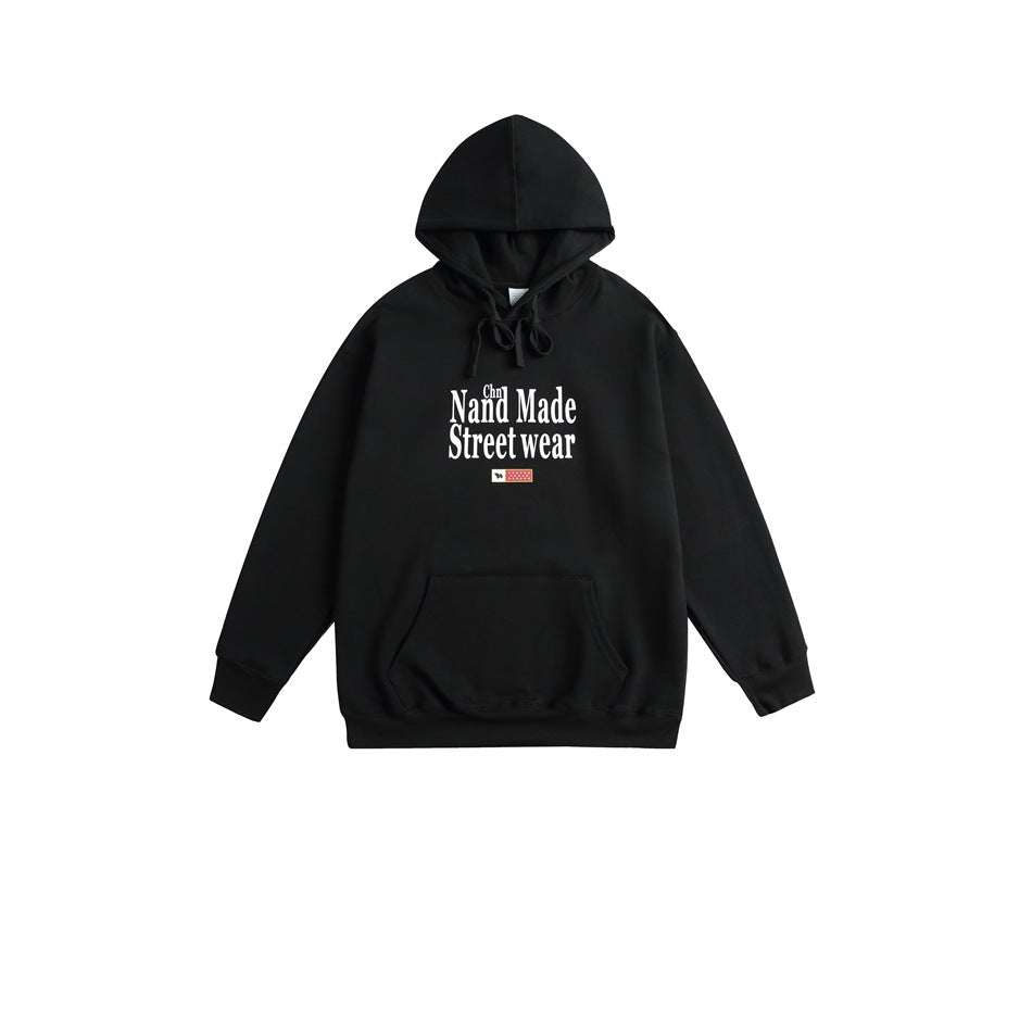 Black pullover hoodie with drawstrings, front pouch pocket, and white Nand Made Street wear chest print, flat lay