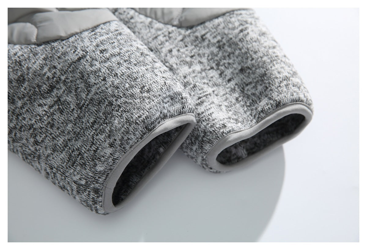 Close-up of gray-and-black marled garment cuffs with light gray binding.