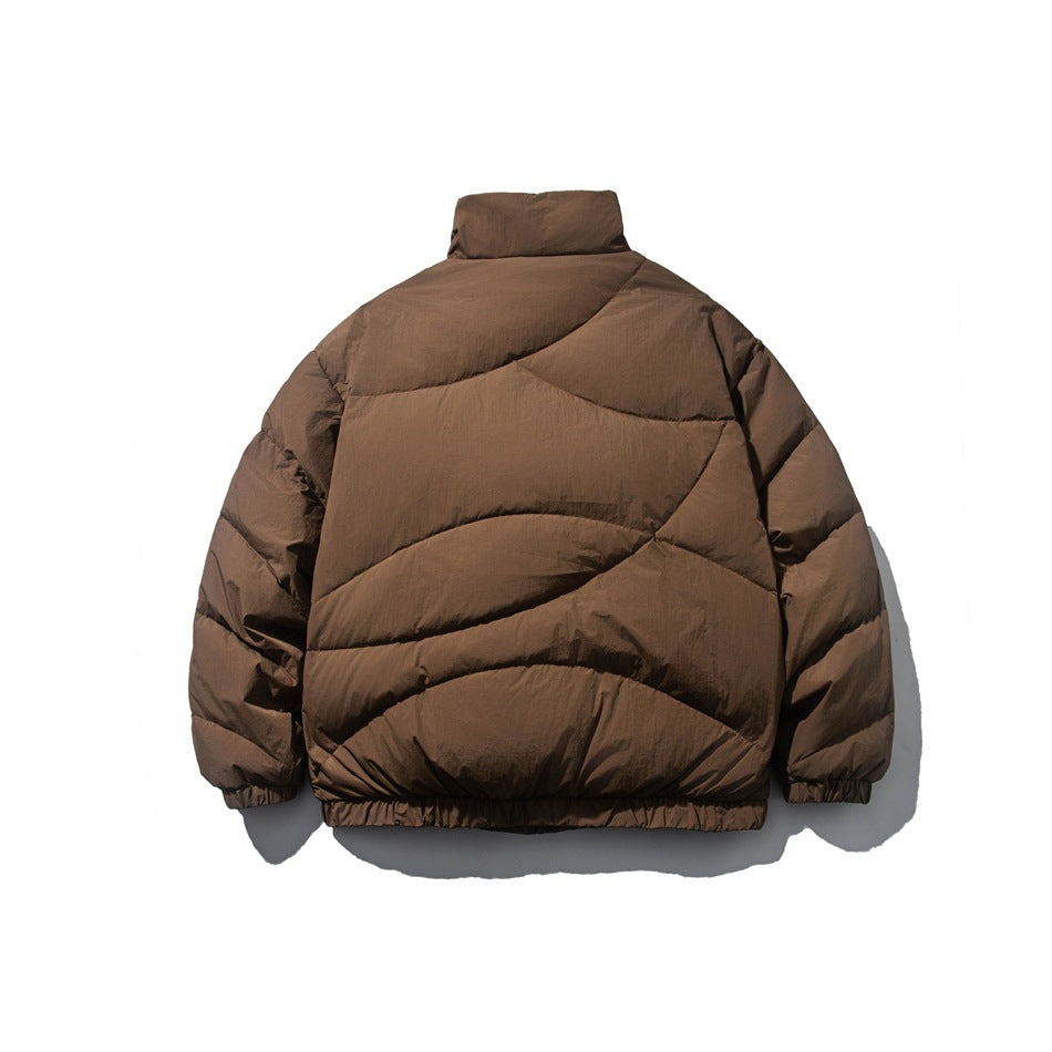 Back view of brown quilted puffer jacket with wave-like quilting lines, stand collar and elastic hem