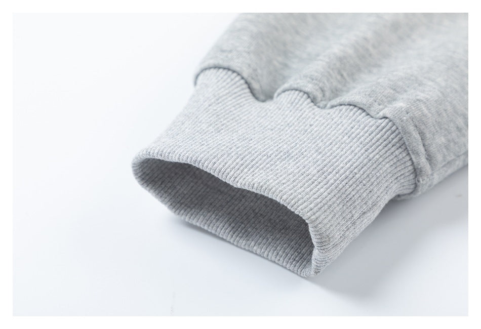 Close-up of a ribbed cuff on a heather gray sleeve.