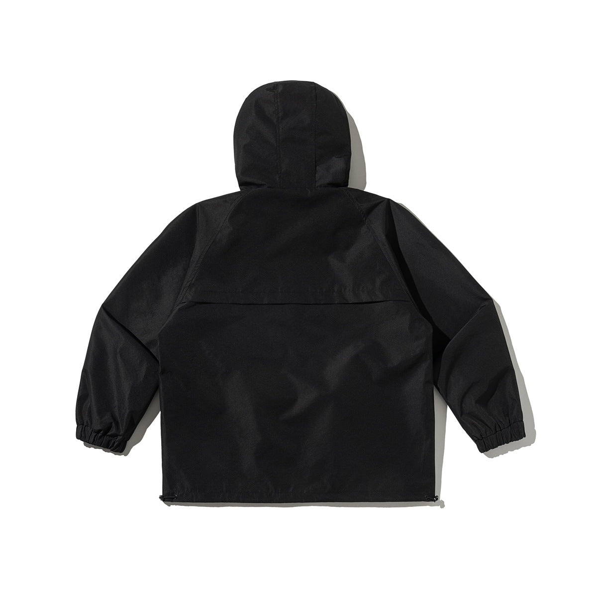 Back view of a black hooded jacket with a rear yoke, gathered cuffs, and adjustable hem.