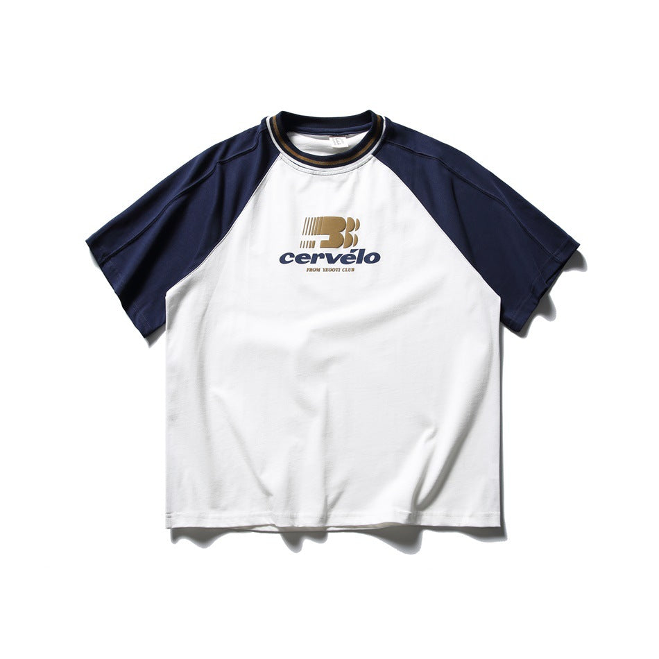 White short-sleeve T-shirt with navy raglan sleeves, striped collar and chest graphic print, flat lay front view