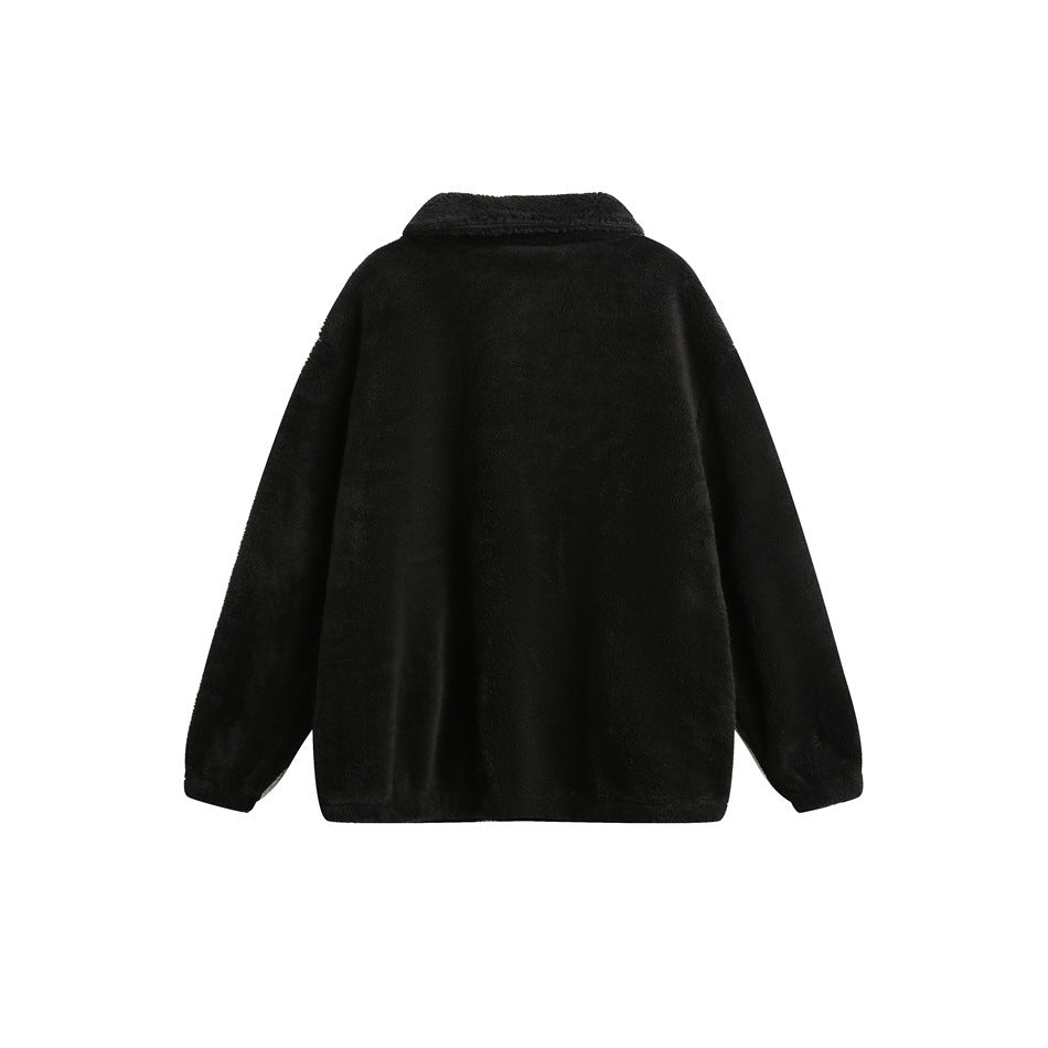 Back view of a black plush pullover with a folded collar and long sleeves, shown flat on white.