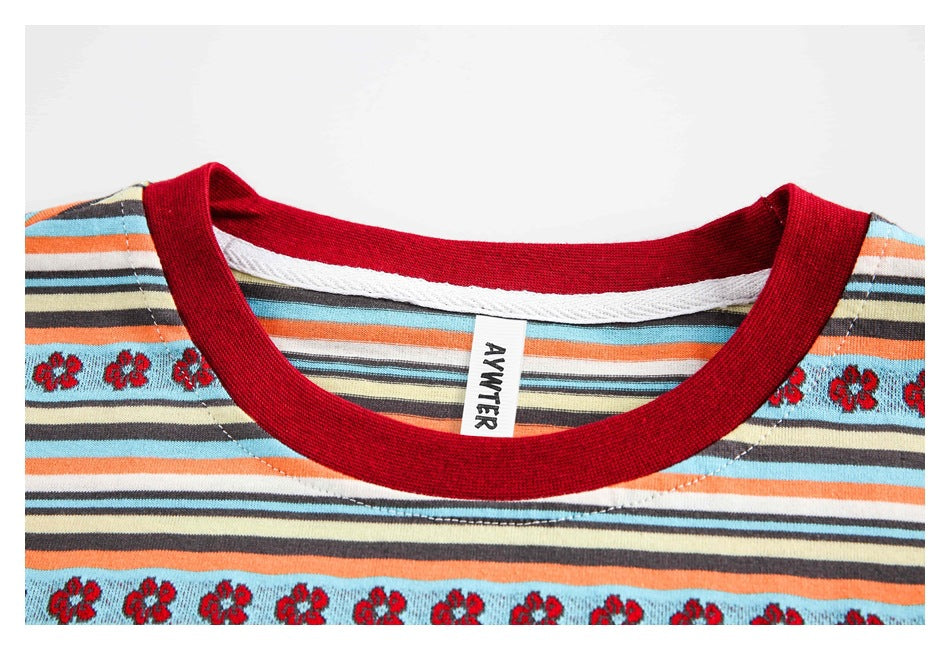 Close-up of a red crew neckline, striped fabric, and a visible garment label.