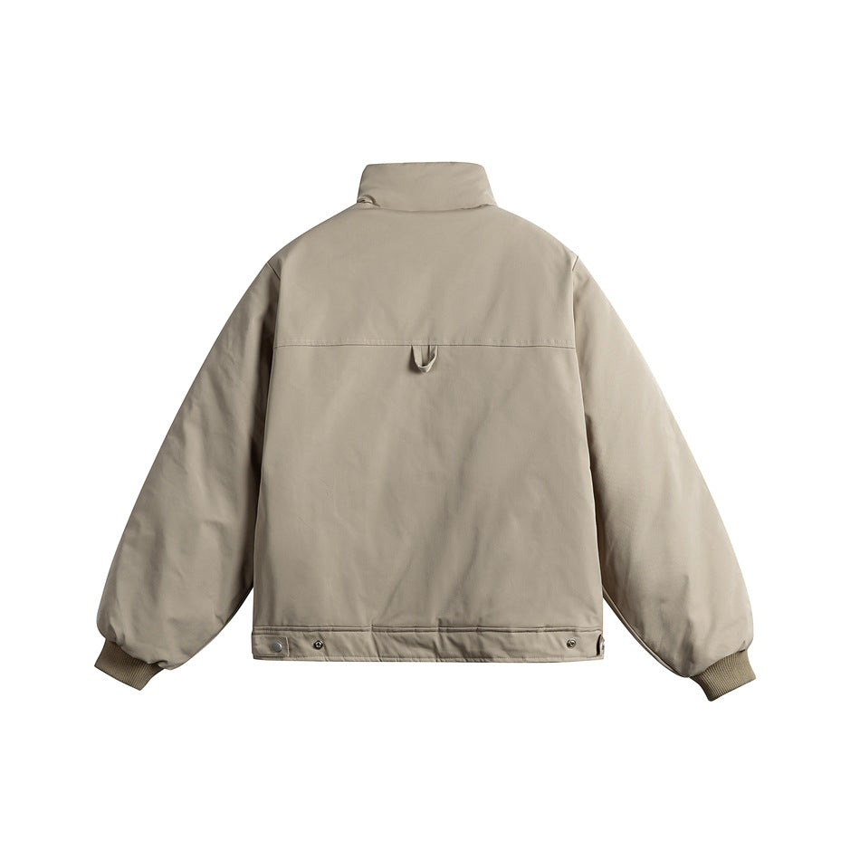 Back view of khaki padded jacket with stand collar, yoke seam, loop tab, snap hem tabs and ribbed cuffs